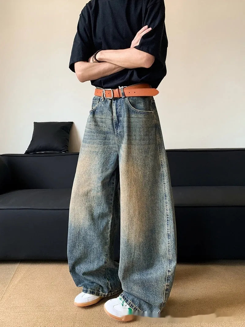 Men's retro blue distressed denim wide-leg jeans with a slimming fit and zip fly