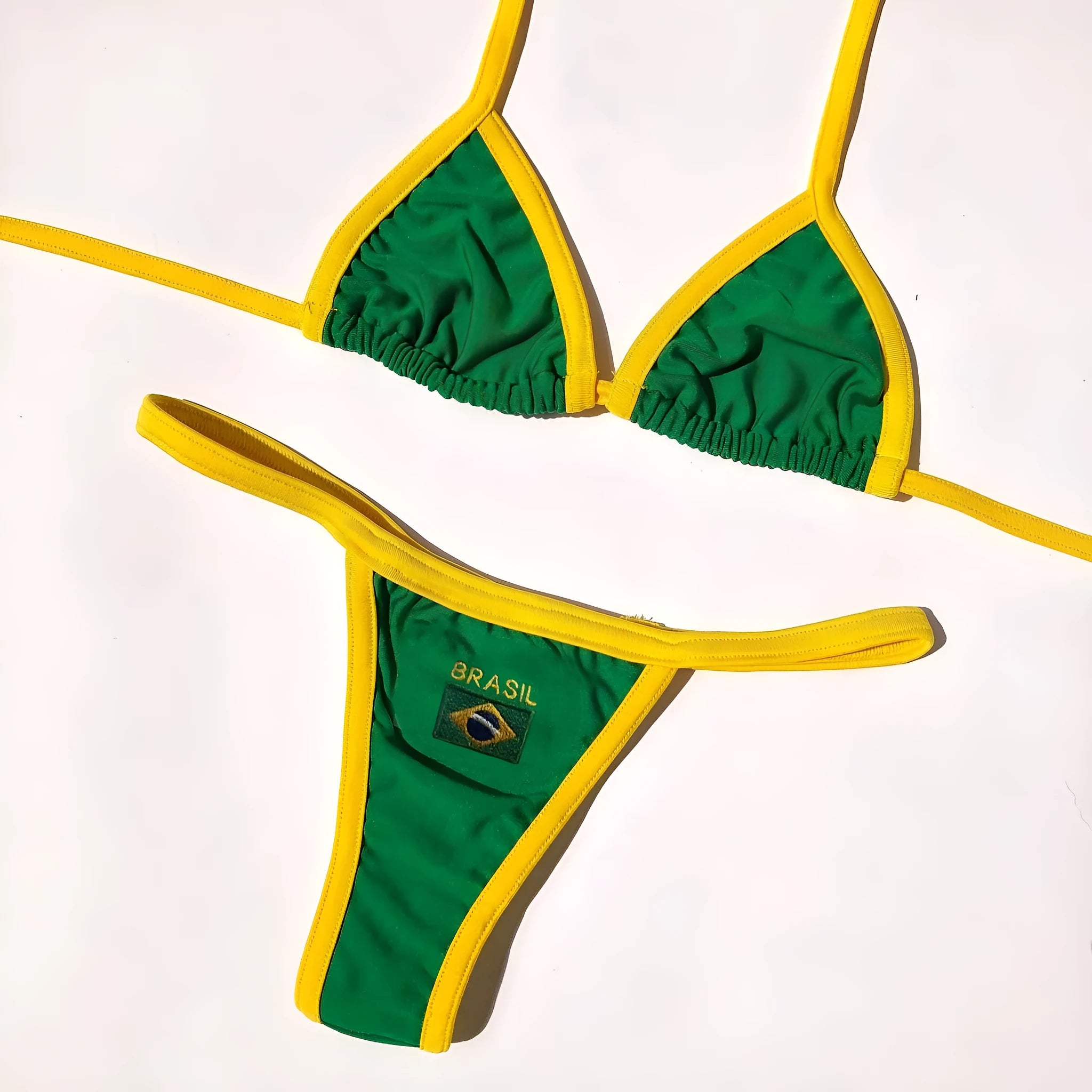 Women's yellow T-back bikini set with shorts-length briefs on a mannequin.
