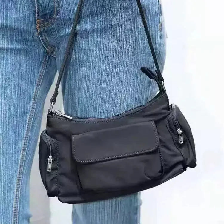 Black PU leather women's shoulder bag with double pockets and side line detail.