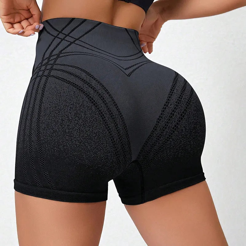 Women's high waisted gradient fitness shorts in black, suitable for running and yoga.