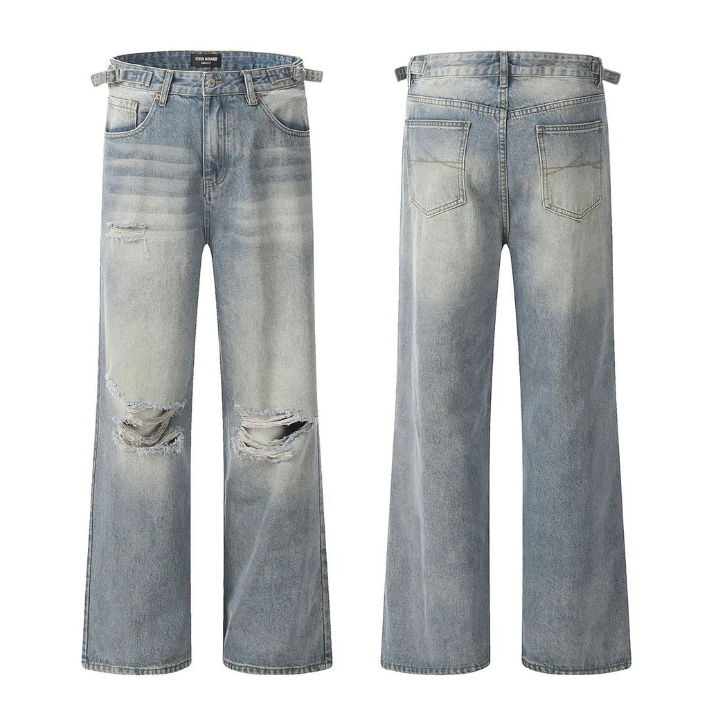 Blue men's straight-leg jeans with ripped detailing on the legs, showing a zipper fly.