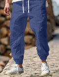 Men's straight-leg linen trousers in apricot colour with an elasticated waistband.