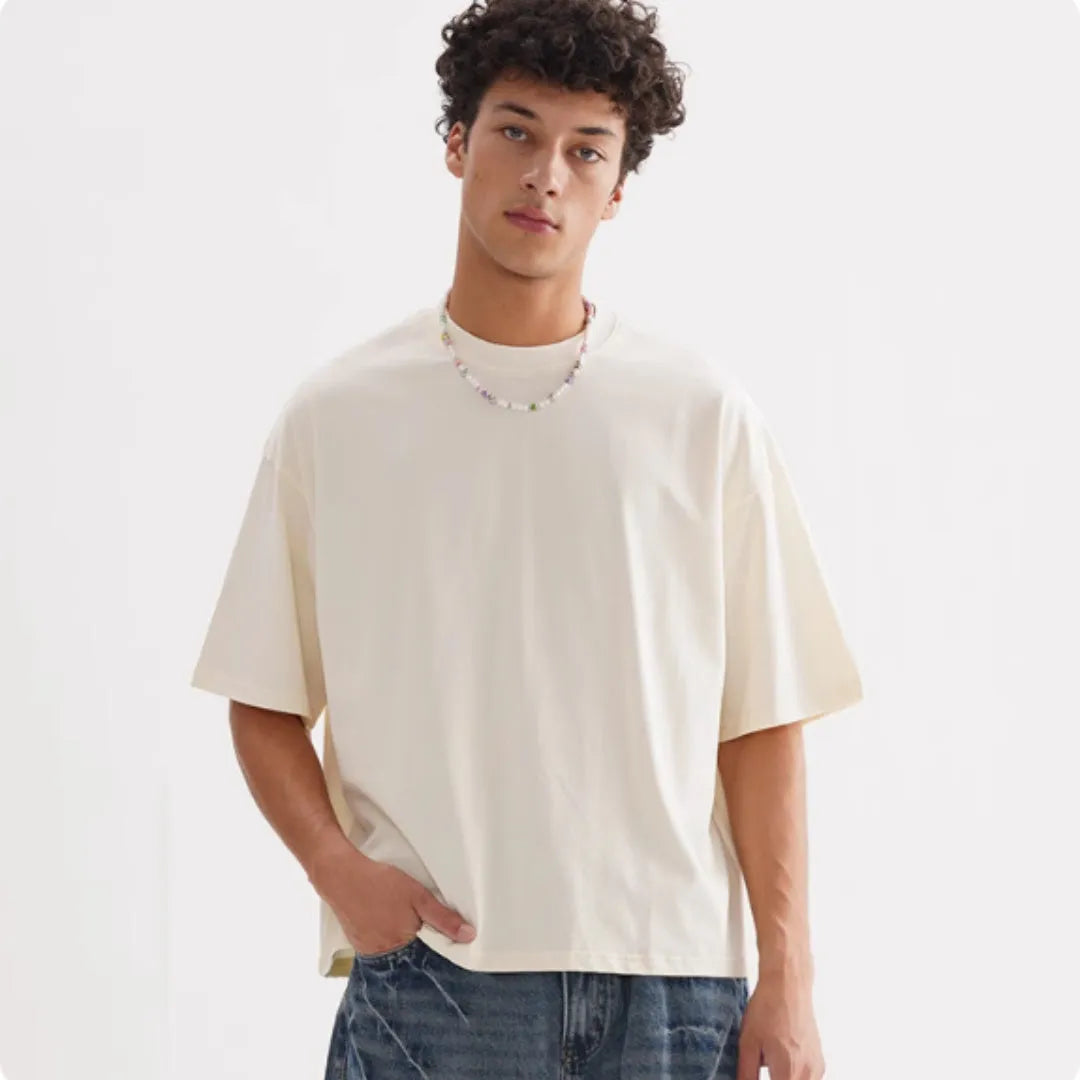 American style loose fit pure cotton t-shirt in apricot colour on a hanger.
