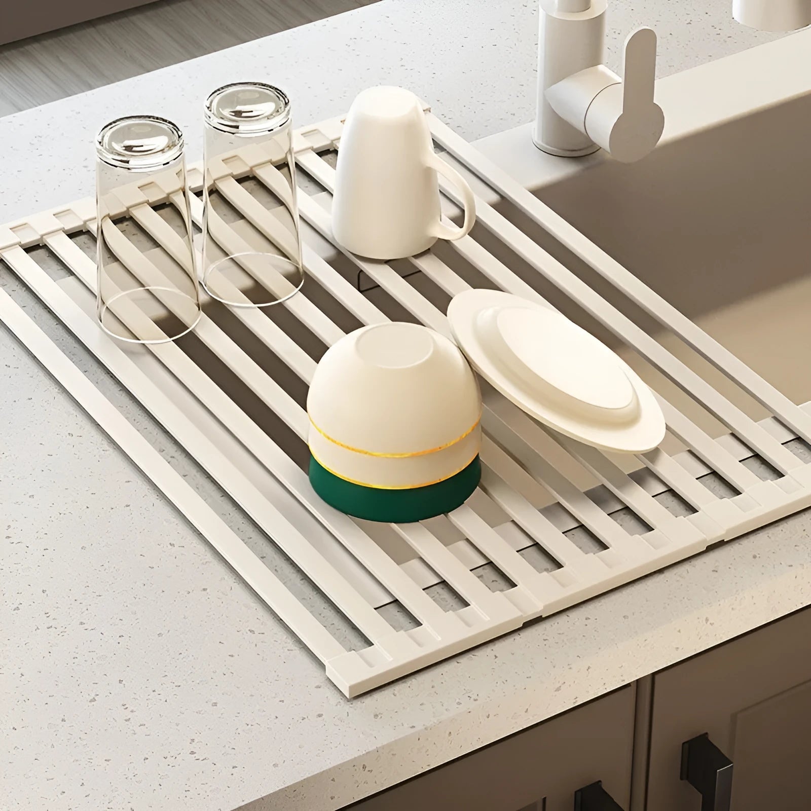 Foldable milky white stainless steel kitchen draining rack inside a sink