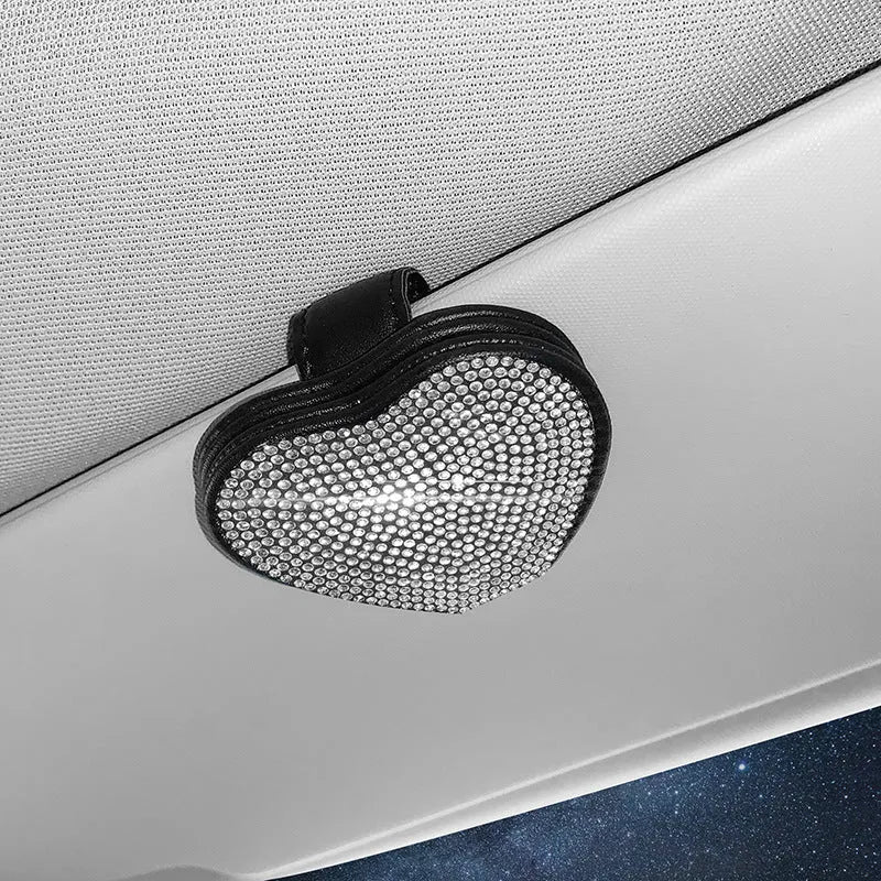 Black PU leather magnetic car sun visor clip holding sunglasses with a slot for tickets.
