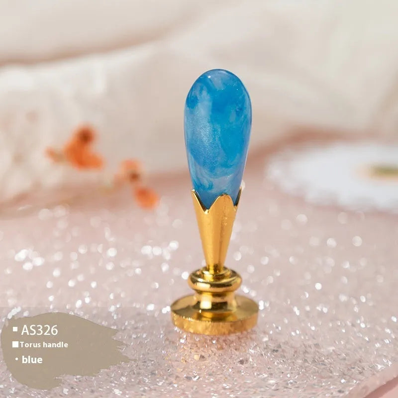 Wooden wax seal handle in a selection of different colour and decorative finishes.