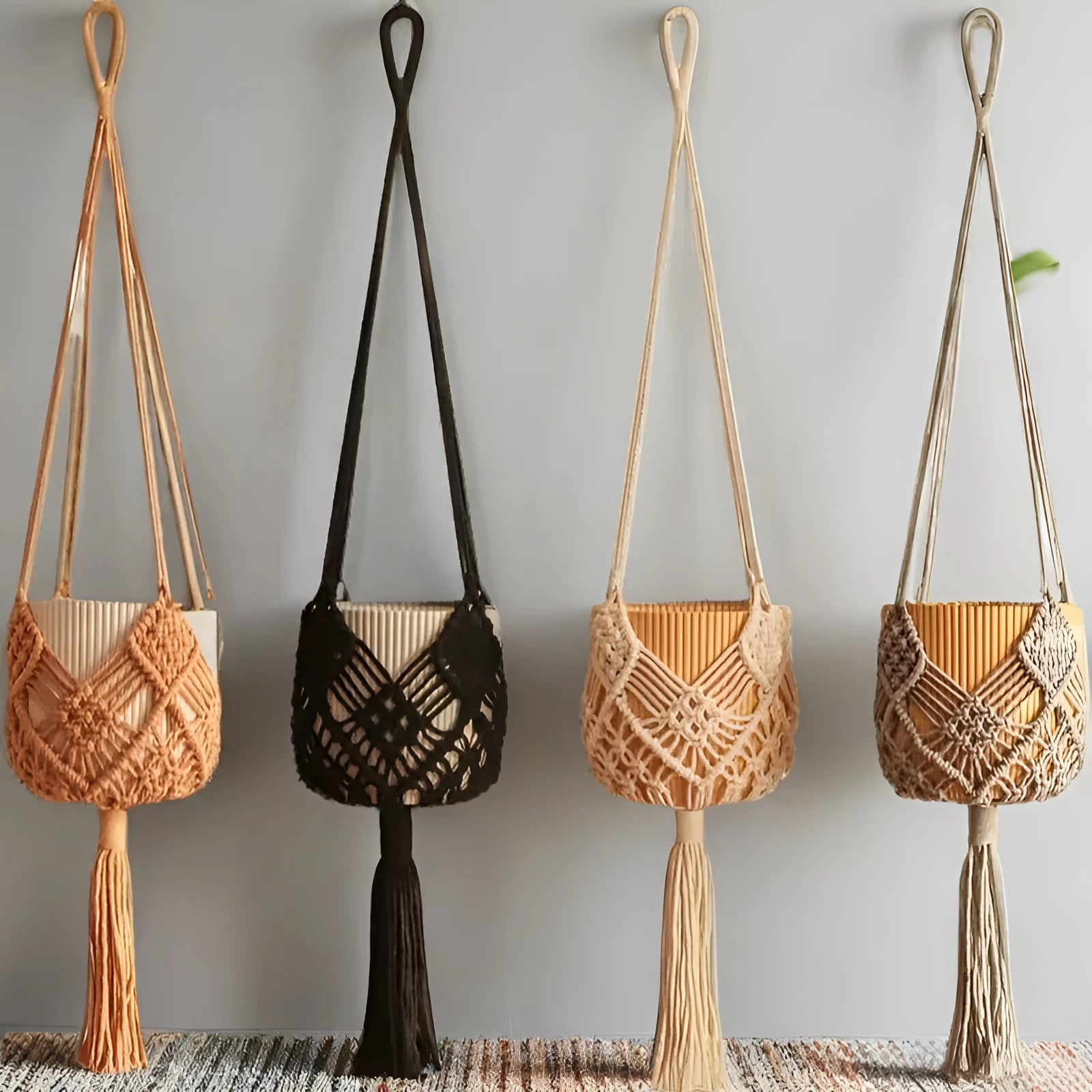 Hand-woven polyester cotton flower pot net pocket in brown, hanging with a green plant.