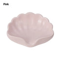 Shell-shaped plastic soap dish in white or pink for bathroom use