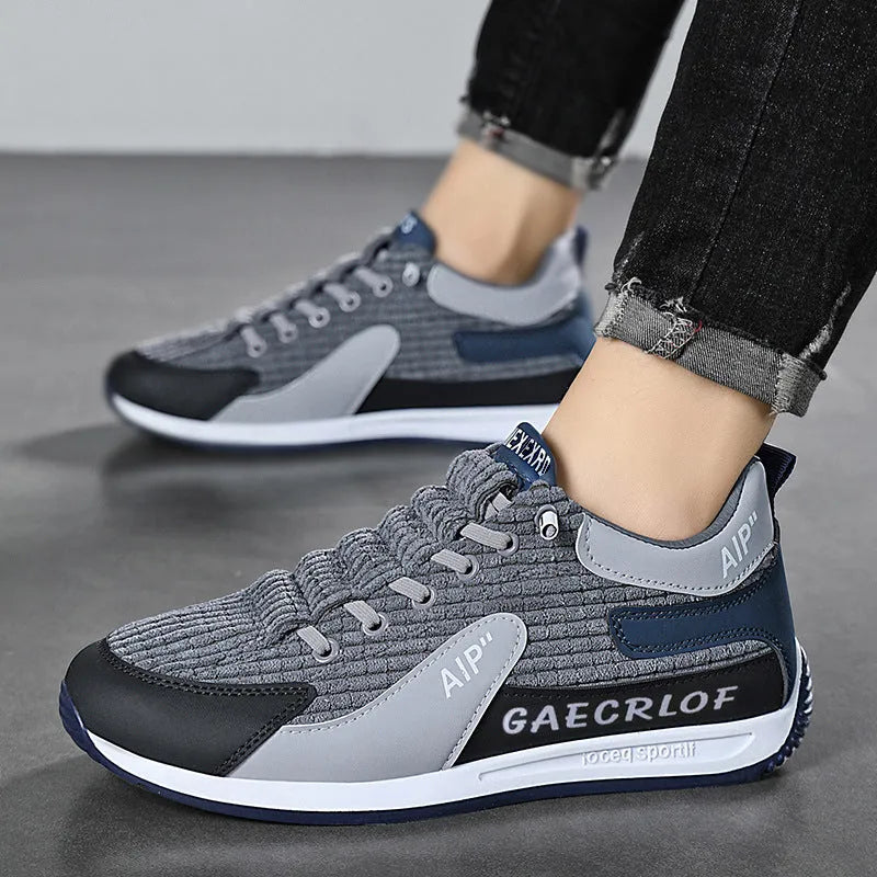 Men's low-top green mesh running shoes with white laces on a grey sole