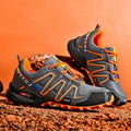 Men's gray orange casual running shoe with synthetic leather upper and low-top design.