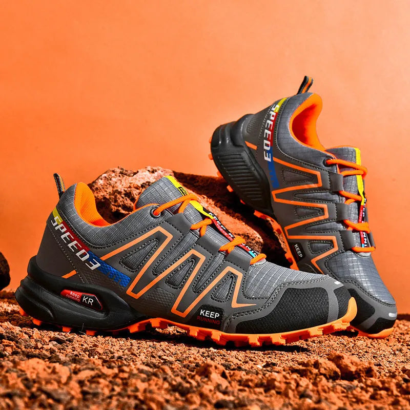 Men's gray orange casual running shoe with synthetic leather upper and low-top design.