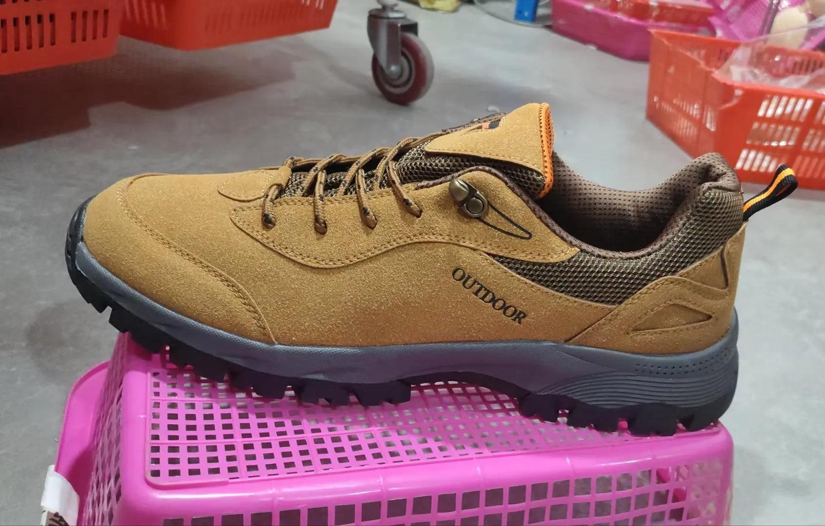 Men's army green low-top hiking shoes on a neutral background, showing the casual design and tread.