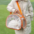 Transparent hard EVA space capsule backpack for cats, shown in green, with shoulder straps and large viewing window.