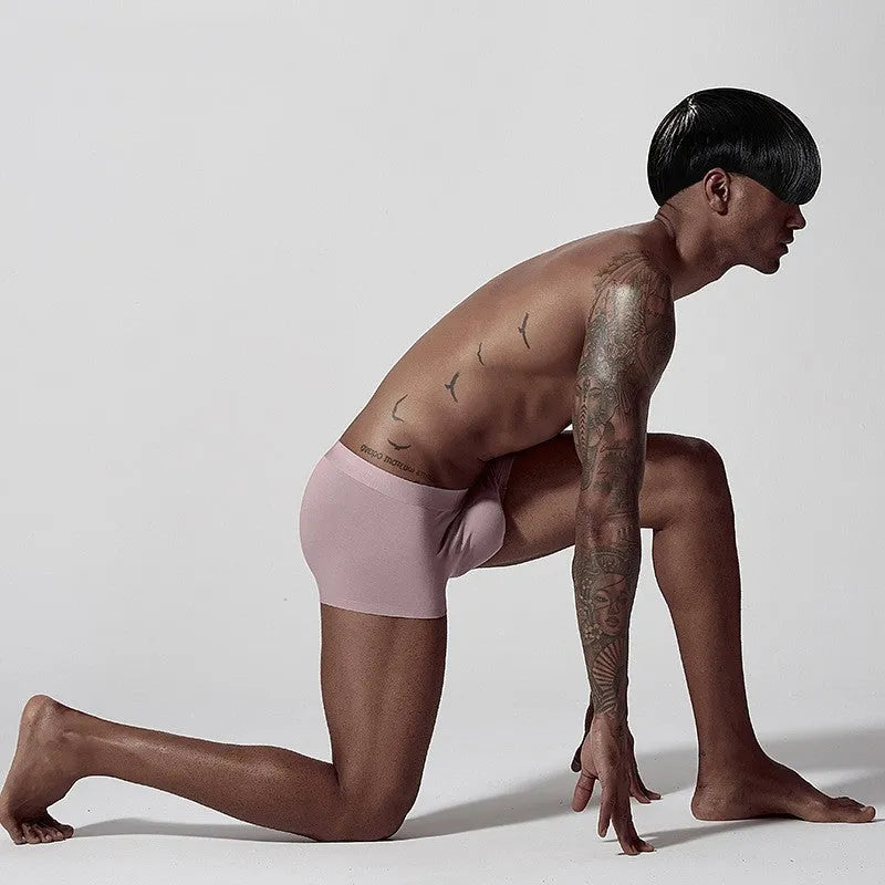 Seamless modal men's underwear in green, pink, and white colours with mid-waist design