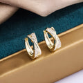 Geometric copper drop earrings with zircon accents and 14K yellow finish