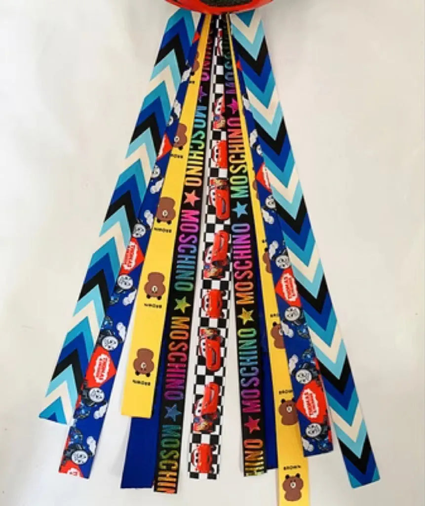 Children's decorative helmet streamer ribbon in multiple colours for roller skating and skiing safety gear.