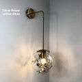Glass shade wall lamp in golden or silver finish with 15cm or 20cm diameter for bedroom lighting