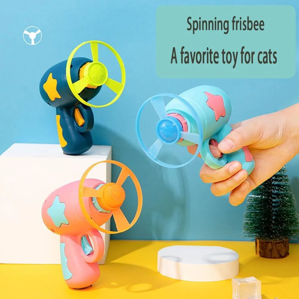 Blue plastic cat toy gun with spinning Frisbee launcher for indoor feline entertainment