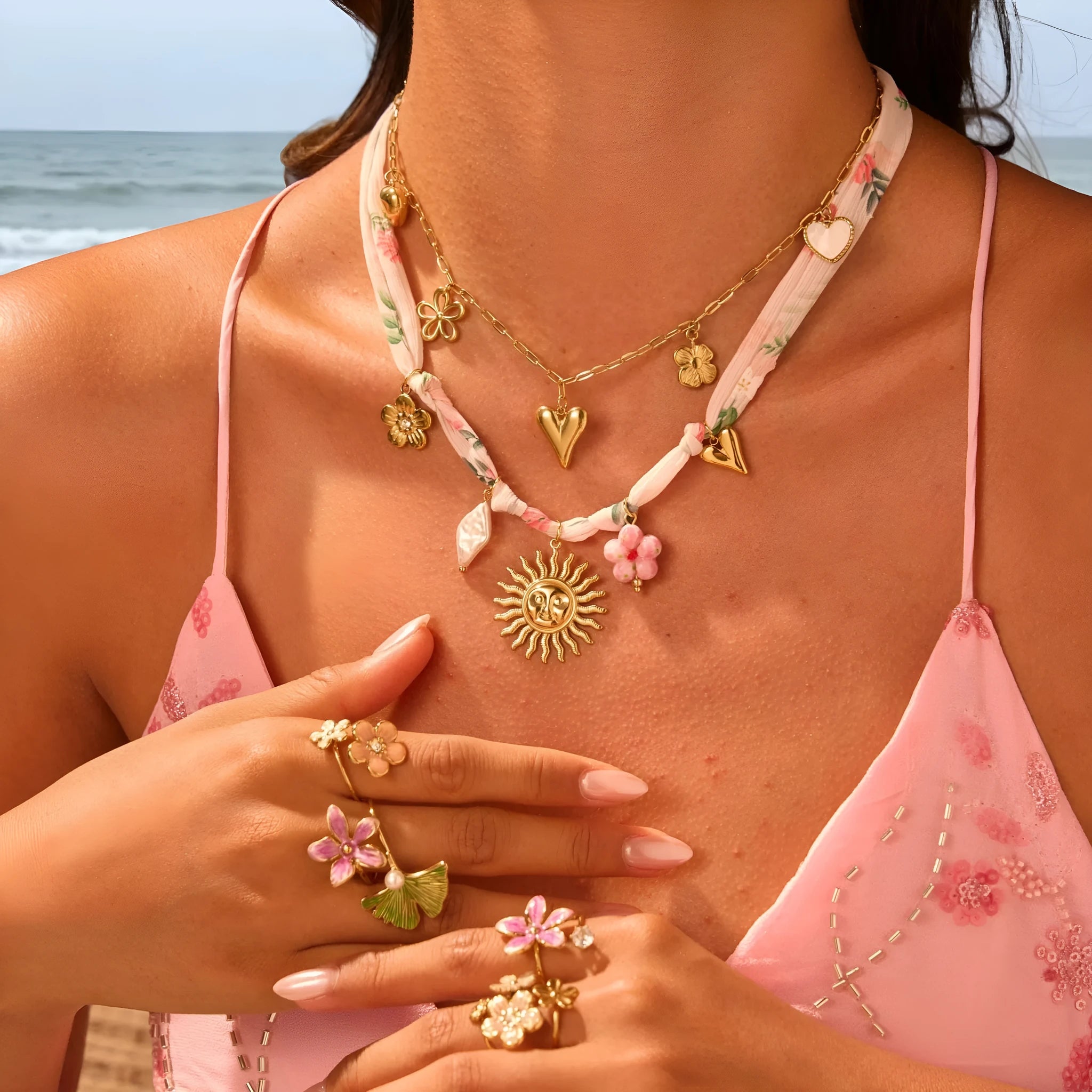 Stainless steel necklace with geometric sun pendant on regular chain, 18K electroplated finish