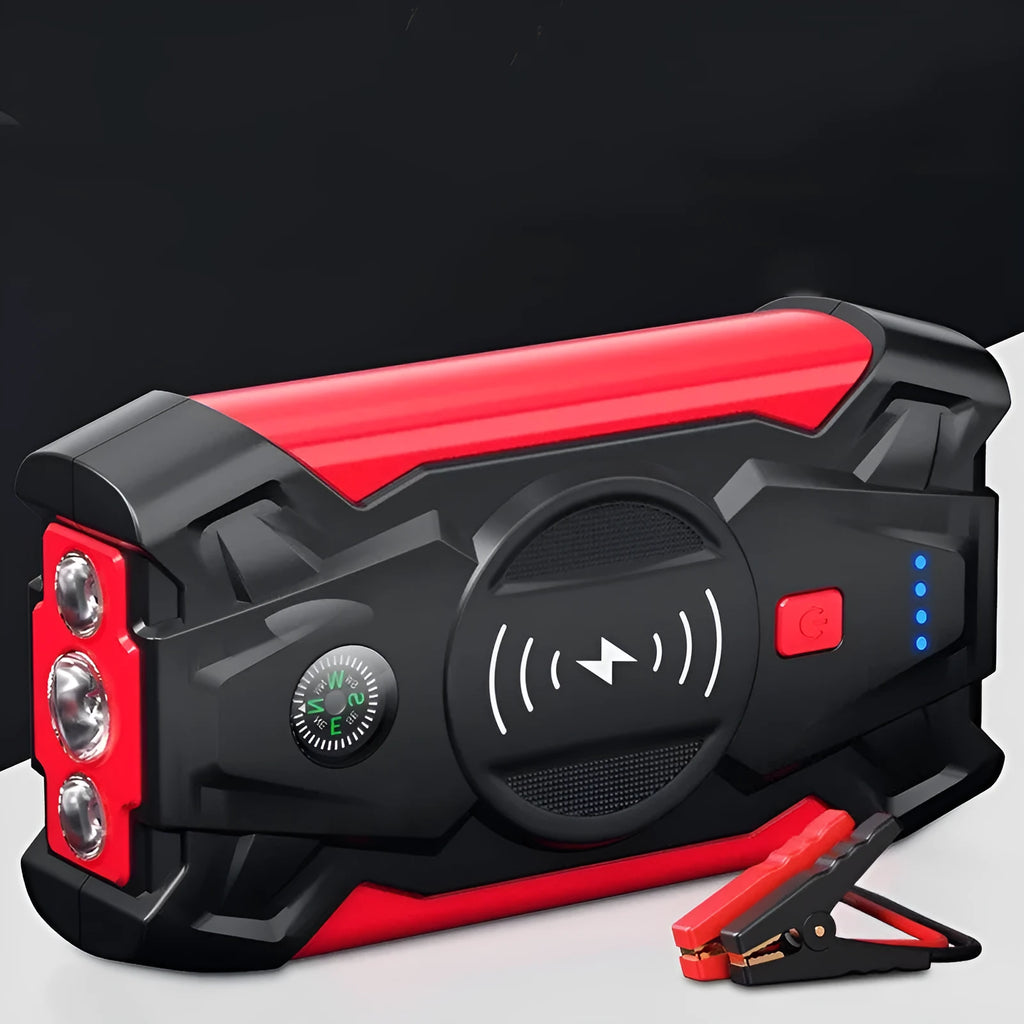 Red portable car jump starter with thick clips and digital display for emergency vehicle battery boosting