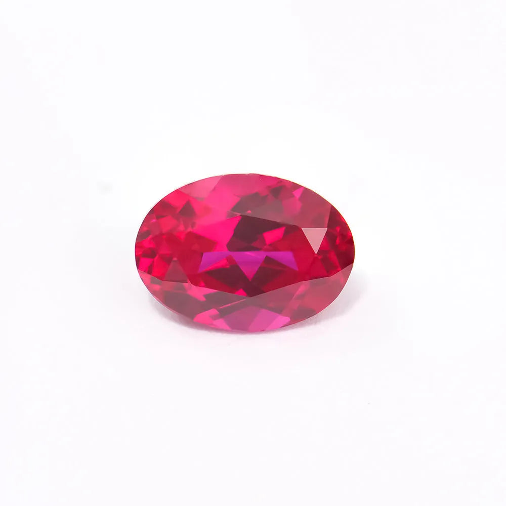 Laboratory-created pigeon blood red ruby gemstone showing different cutting styles including round, princess, and water drop