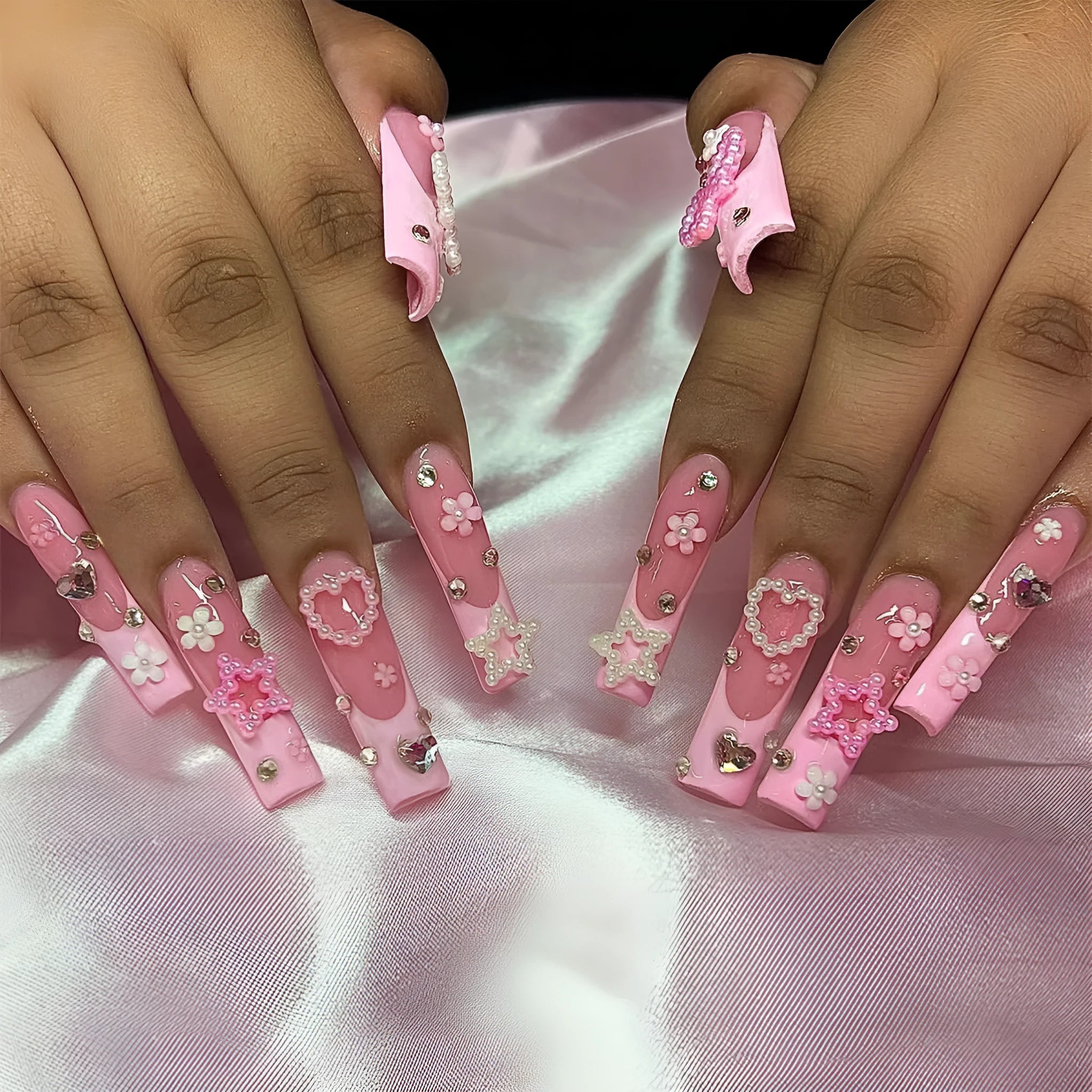 Super long pointed false nails with French spot drill bow design and love pattern in colour XB-70-48.