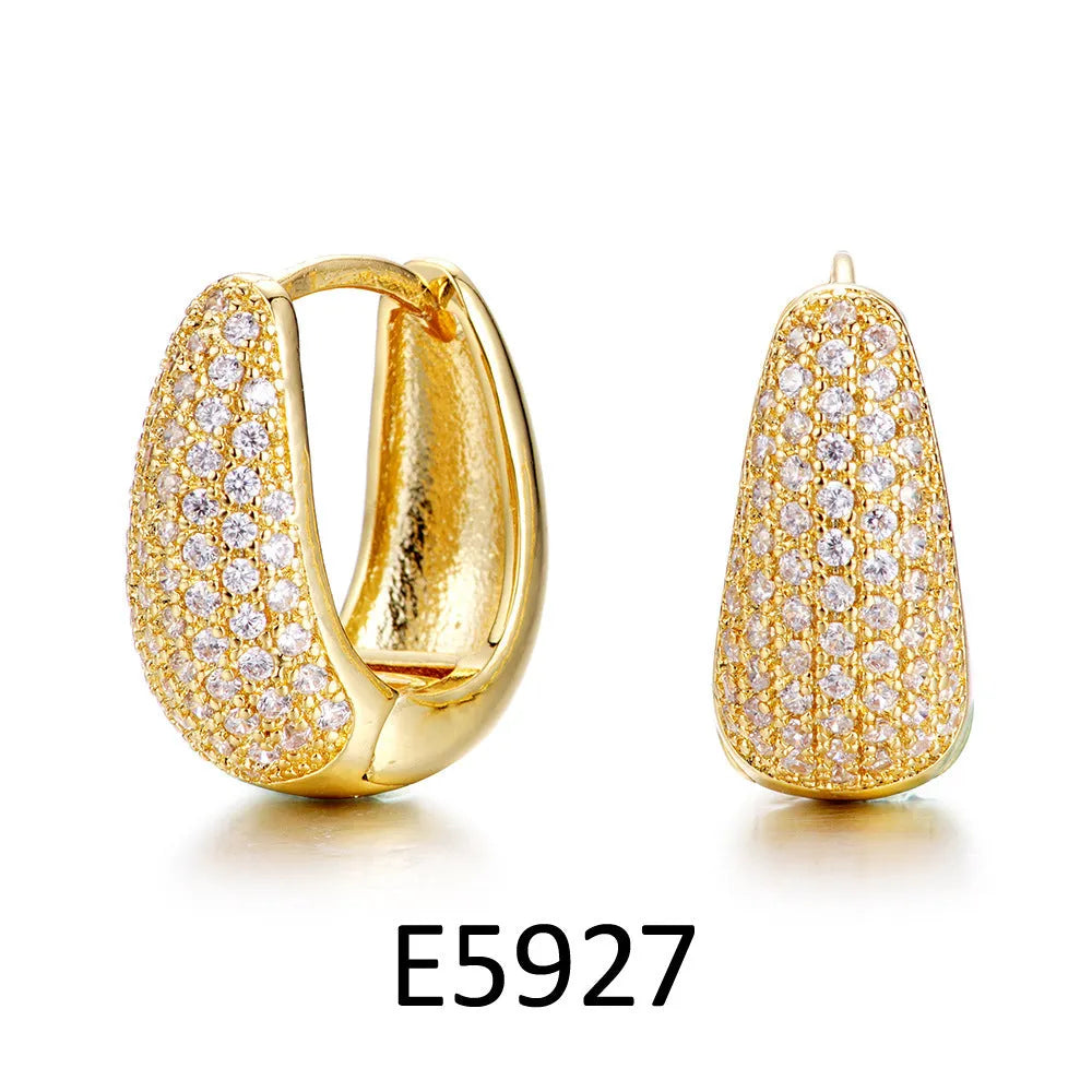 Gold plated heart-shaped clip earrings with zircon stones and gang drill decorative elements