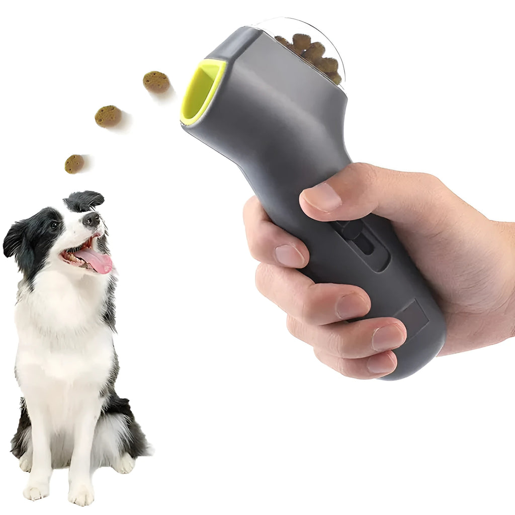 Grey plastic pet snack launcher toy with spring trigger mechanism for treat dispensing