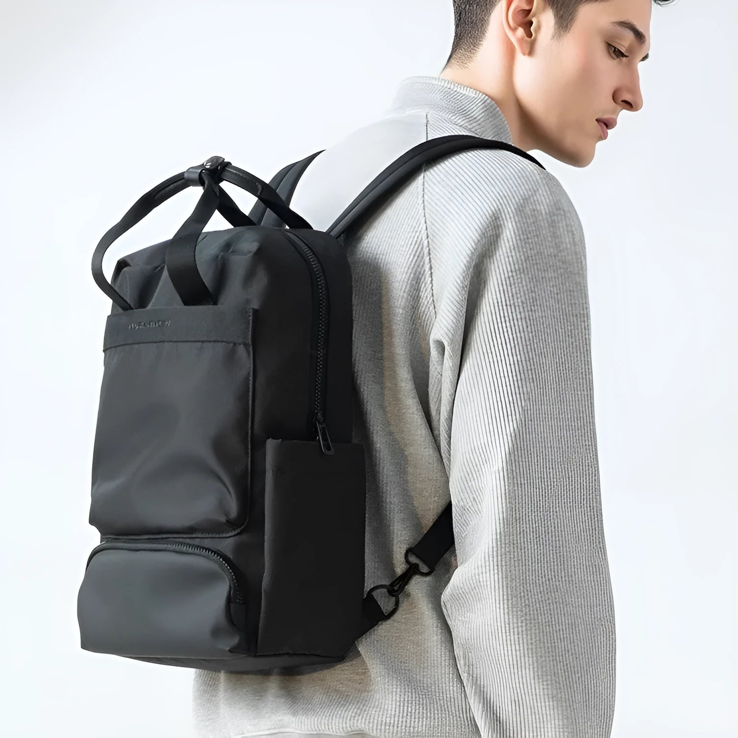 Elegant black Oxford cloth computer backpack with 20-35 litre capacity and a laptop compartment.