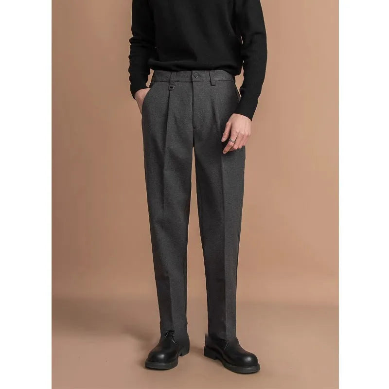 Men's straight leg casual business trousers in black, shown in a light business style setting.