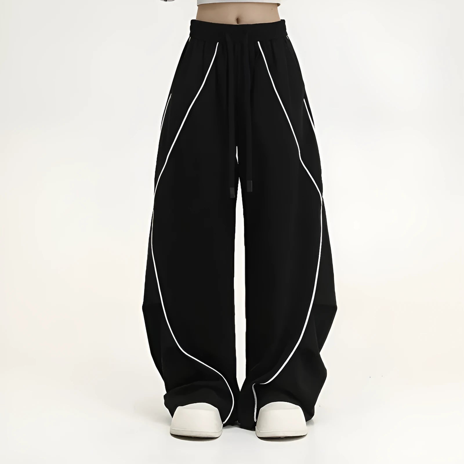 Black wide-leg trousers with vertical stripes and a pleated mid-waistband.