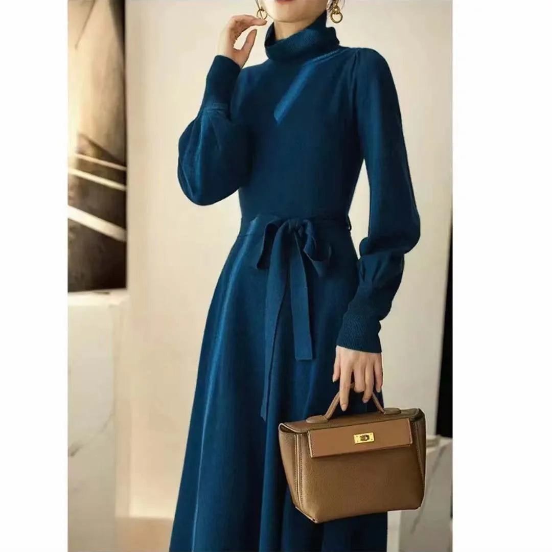 A rose red loose-fit turtleneck knit dress for women with long sleeves and a mid-length flared skirt.
