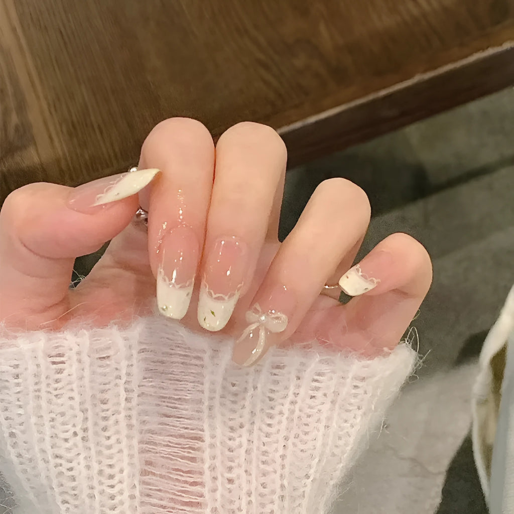Set of colourful press-on false nails for girls with adhesive tabs on a white background.