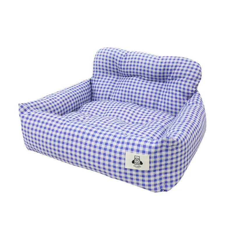 Blue plaid fabric car-mounted dog travel nest for small or medium dogs on a car seat