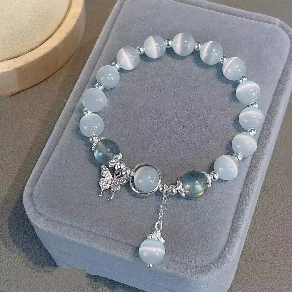 Handcrafted grey moonlight glass butterfly bracelet with coloured glaze beads and round charms
