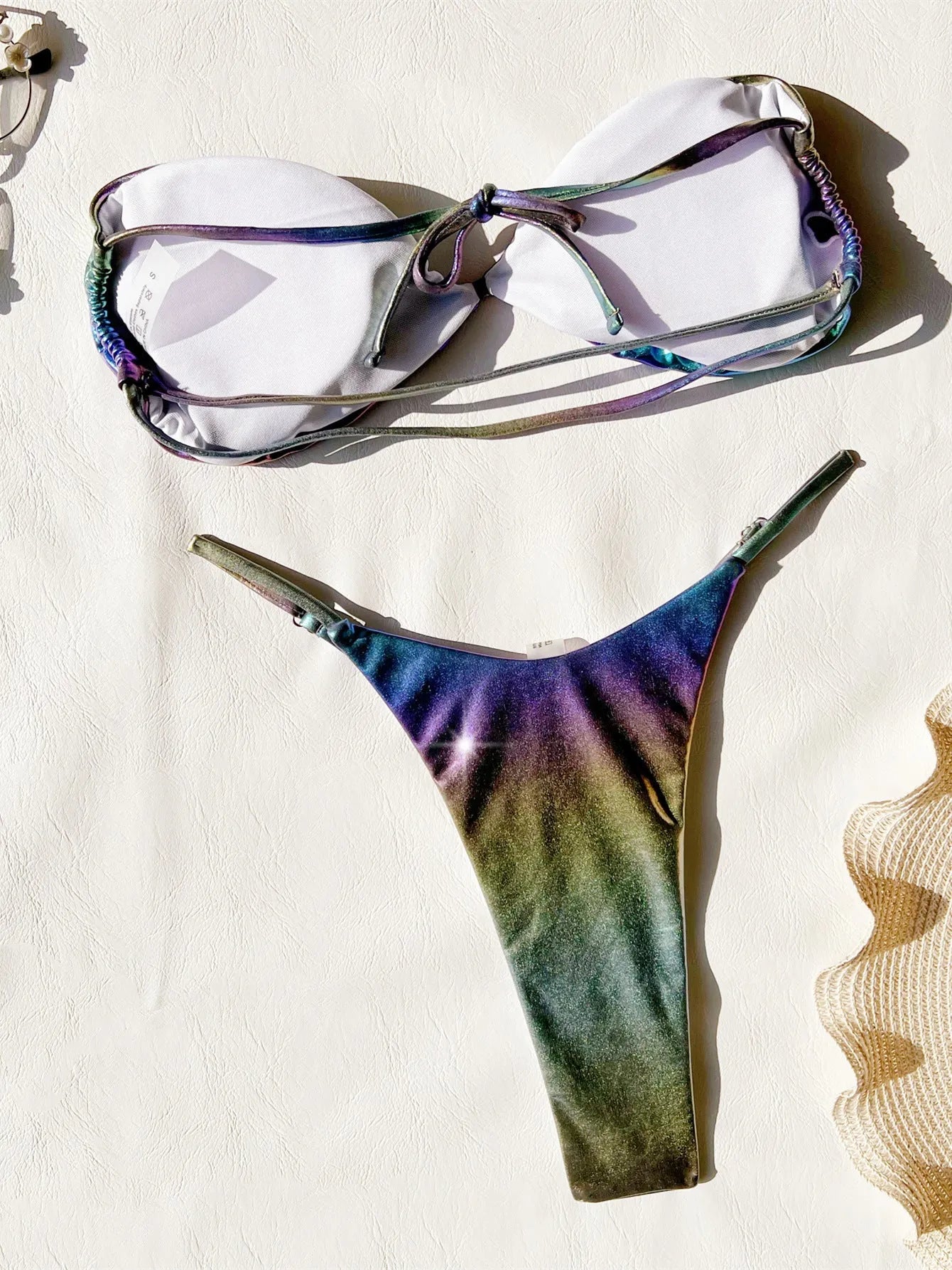 Women's gradient purple bikini swimsuit set on a mannequin.