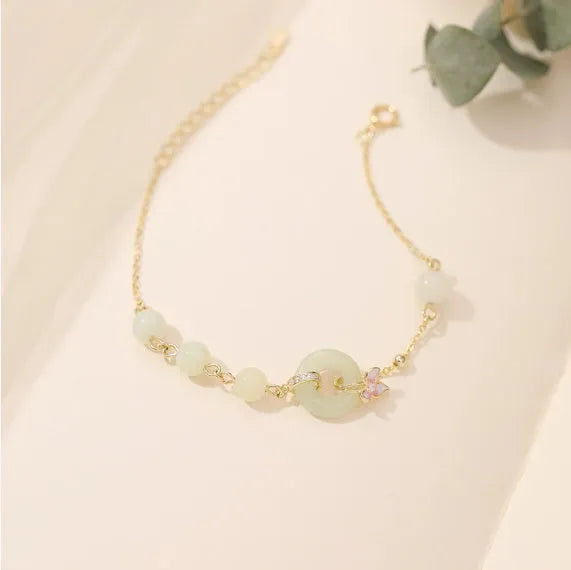 Silver orchid necklace with peace buckle clasp and floral pendant on O-ring chain
