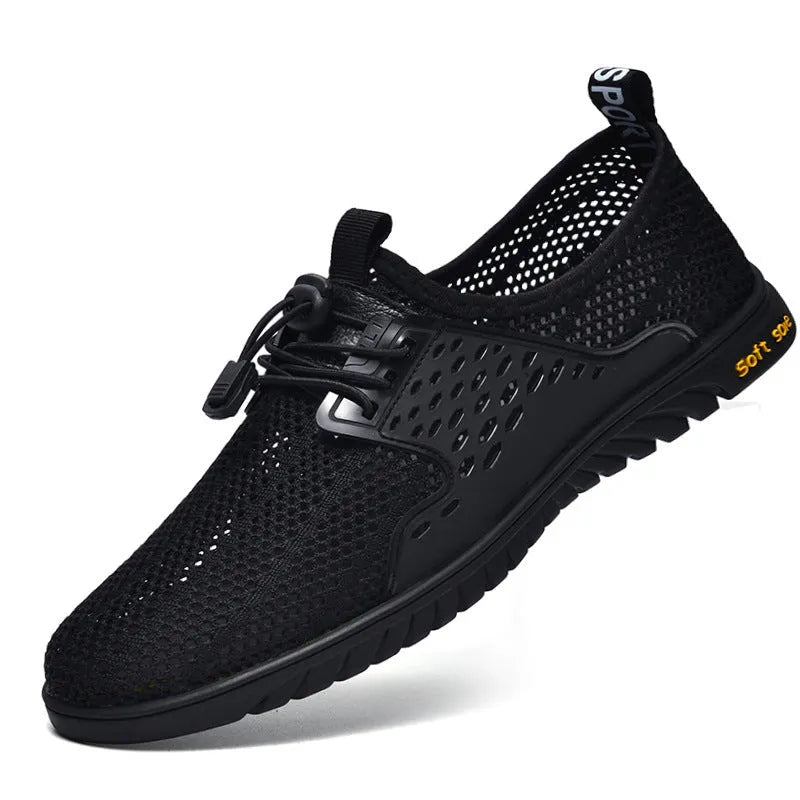 Men's black breathable mesh casual shoes with elastic band and rubber sole.