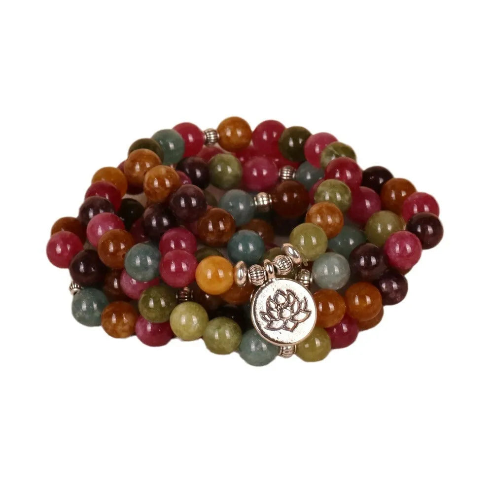 108 bead multi-layer bracelet with lotus pendant in Tourmaline colour and alloy construction.