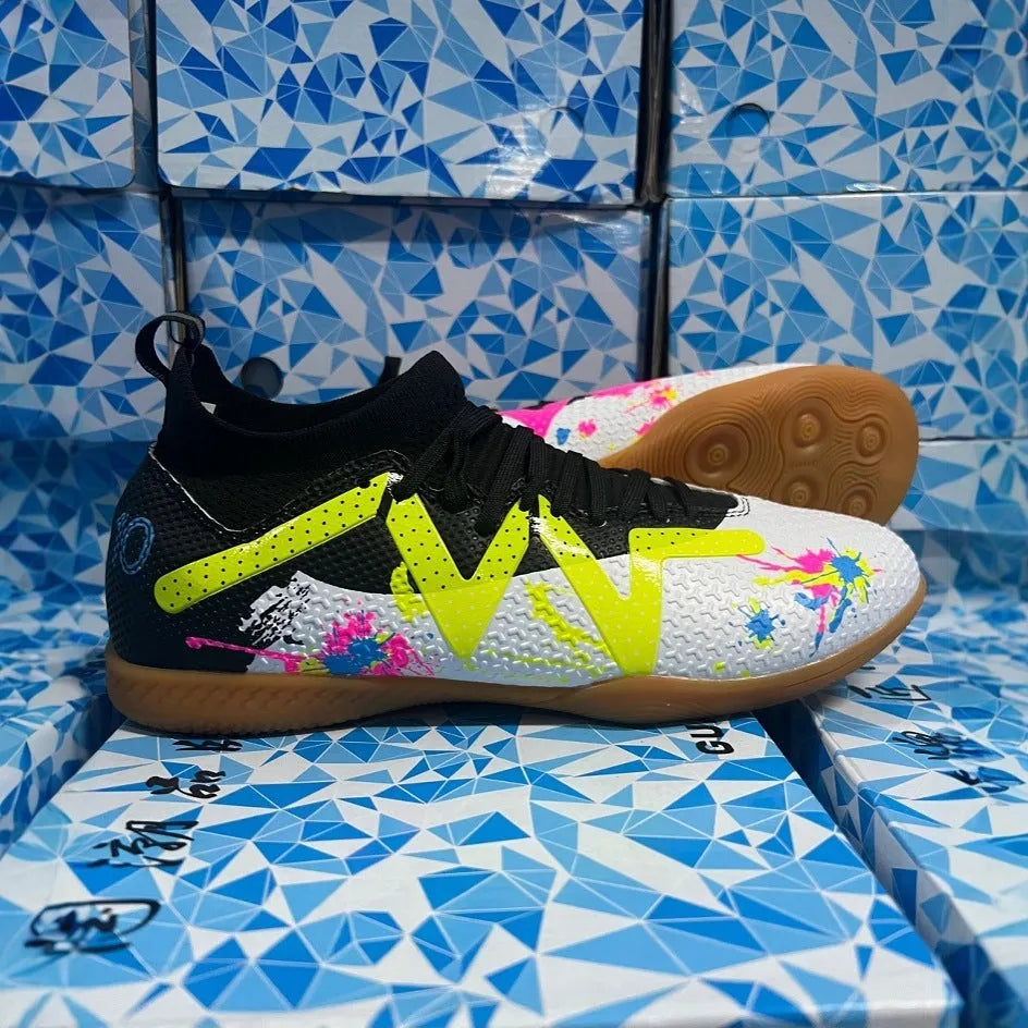 Adult low-top football boots with non-slip rubber outsole, available in black and yellow, white, and black colourways.