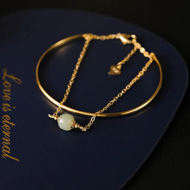 Women's Hetian jade bracelet with gold inlay detail, shown in single, double, and three bead versions.