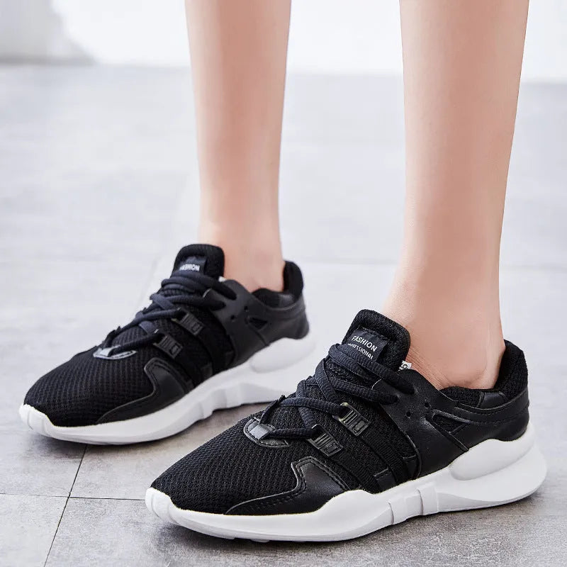 Low-top casual sneaker with mesh hollow-out upper and flat EVA sole in white.