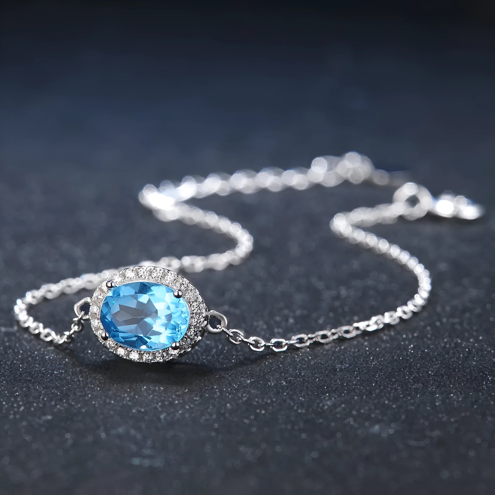 925 sterling silver blue topaz geometric jewellery set with earrings, ring, necklace, and pendant