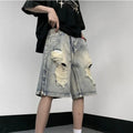 Blue distressed denim shorts with wide-leg loose fit and retro tattered styling on hanger