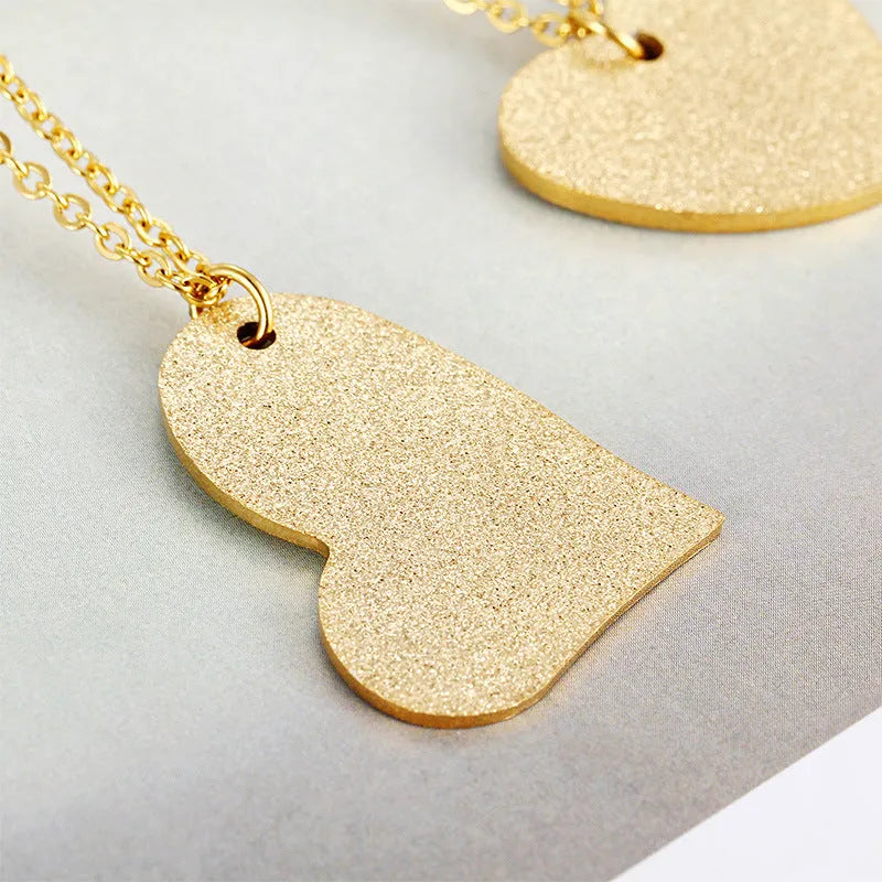 Silver geometric heart pendant necklace on a 45 cm titanium steel chain.