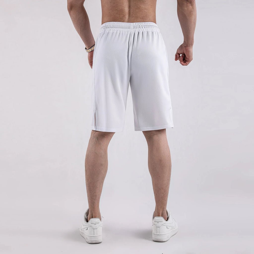 Man wearing black quick-dry mesh fitness shorts with a loose, casual fit and elasticated waistband.