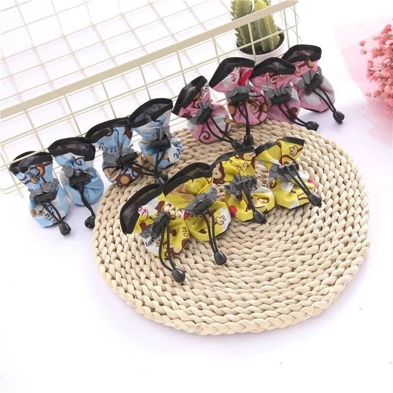 Soft sole cloth dog shoes showing multiple colour options including fleece-lined and monkey print designs