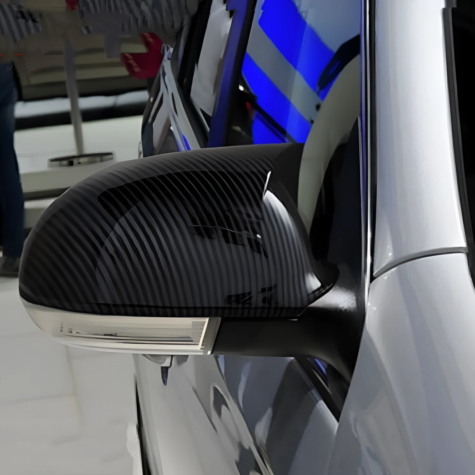 Volkswagen Sagitar exterior mirror housing shells in horn bright black plastic, pair shown
