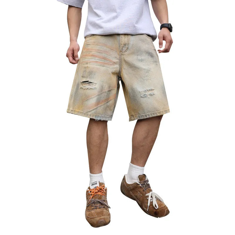 Men's light blue denim shorts with ripped detailing and a straight-leg cut.