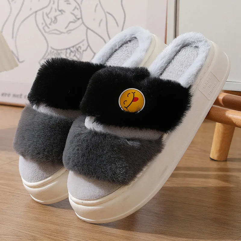 Cartoon-style pink and green thermal plush slippers with cashmere lining.